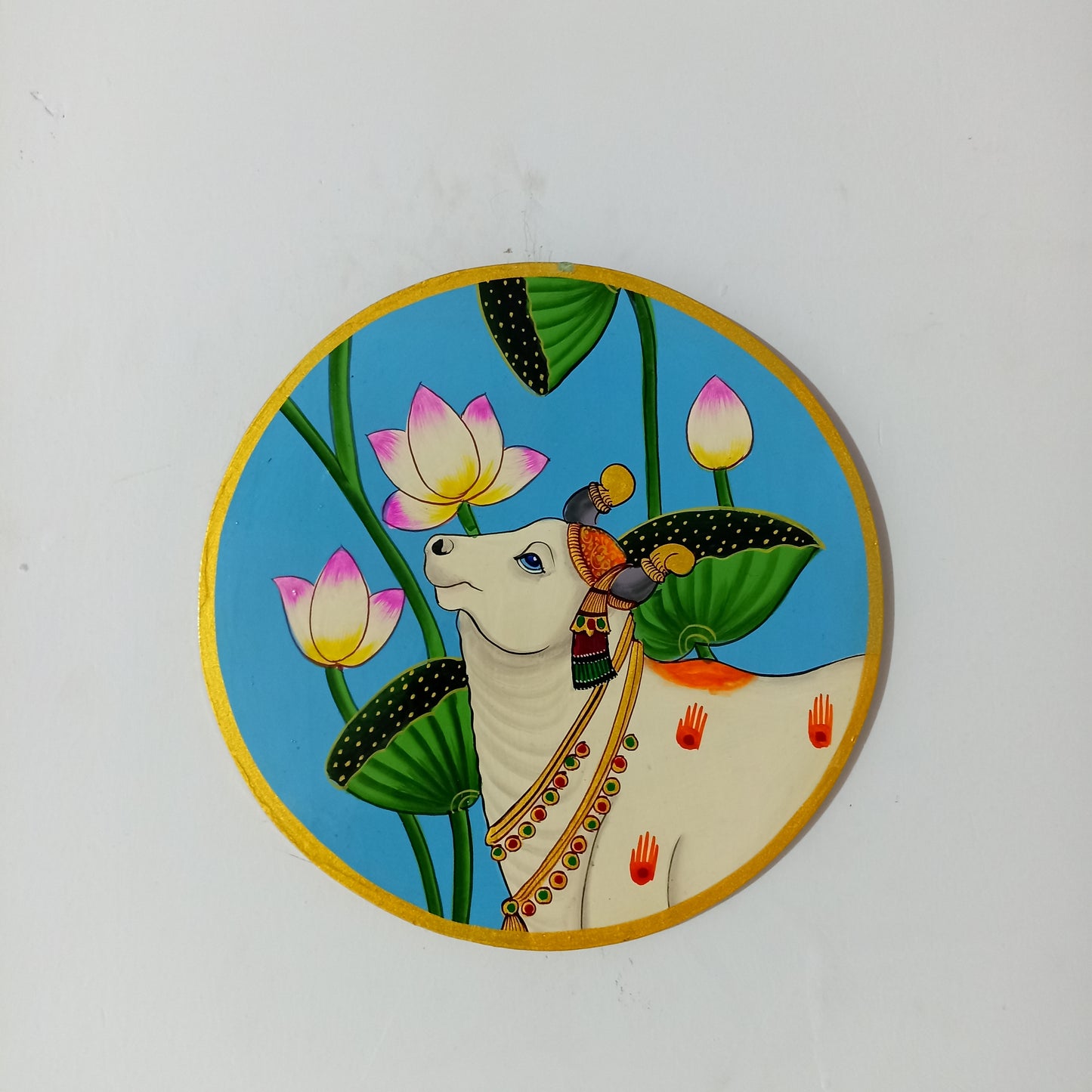 Hand-Painted Wooden Wall Plate – Kamdhenu Cow with Lotus Motif (10 Inch)